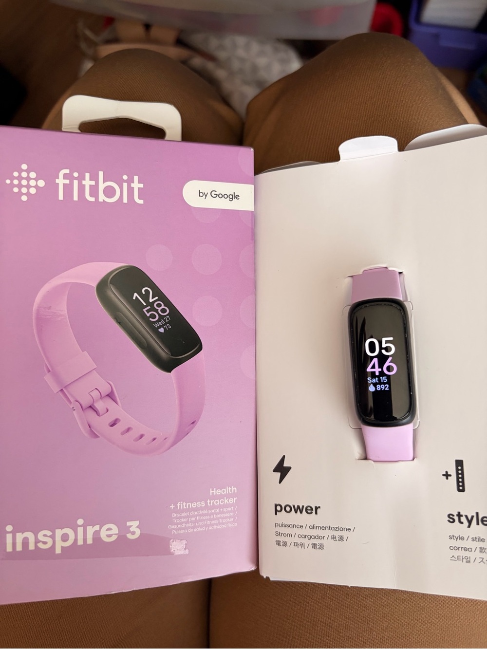 fitbit fitness tracker in lavender pink
